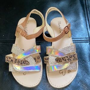 Cute worn natural toned little girl sandals.
